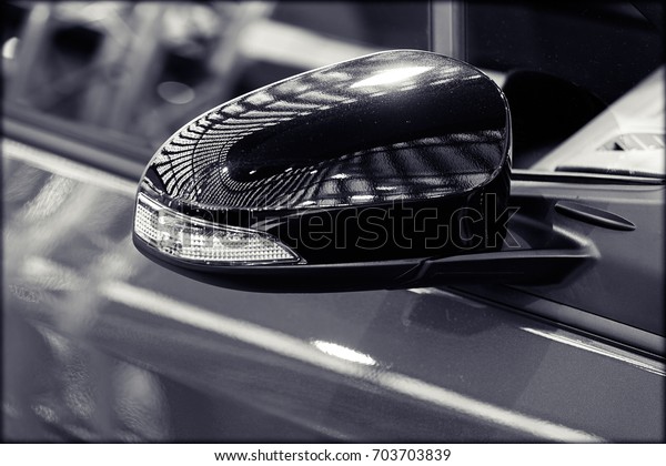 rearview mirror on the motor vehicle, note shallow
depth of field