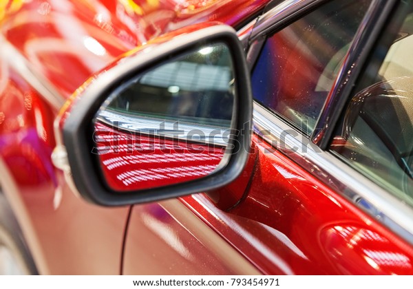 rearview mirror on the motor vehicle, note shallow\
depth of field