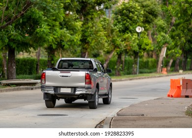 Rearview Of A Pickup Truck On The Road.