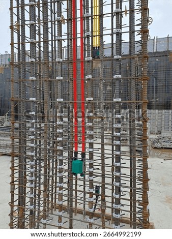 Rebar Structure with Electrical Conduits at Construction Site