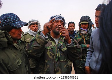 Rebel Army Soldiers Are Discussing News From The Front Line. Rebels Fight Against Gaddafi's Military Forces. Ajdabiya, Libya, April 7, 2011.