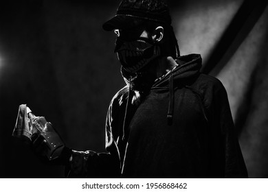 Rebel with molotov cocktail posing over dark background - Shutterstock ID 1956868462