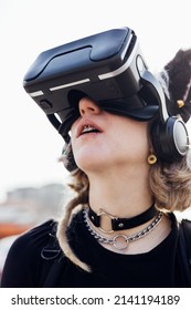 Rebel Young Diverse Woman Outdoor Addicted To Metaverse Using Three Dimensional Headset 5g Technology