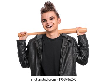 Rebellious Teen Boy Dressed In Black, Isolated On White Background. Young Teenager In Style Of Punk Goth Wearing Leather Jacket, Holding Wooden Bat. Problems Of Transitional Age