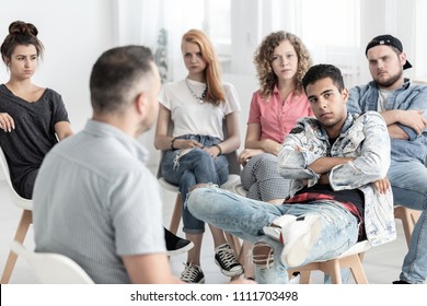 Rebellious Teenage Man During Therapy For Difficult Youth