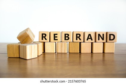 Rebrand and brand symbol. The concept word Rebrand on wooden cubes. Beautiful wooden table, white background, copy space. Business rebrand and brand concept. - Powered by Shutterstock