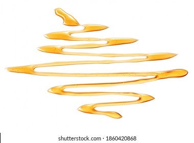 Receding Drizzle Of Honey In Zigzag Pattern On A White Background Viewed Low Angle For Food Styling Or Advertising Concepts