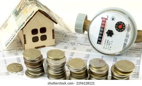receipt for utilities. The hot water meter on the receipt with the money. the concept of utility payments - Shutterstock ID 2196128121