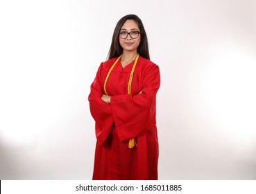 A Recent Female Graduate Poses For A Portrait.