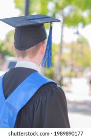 Recent School Graduate In Cap And Gown.