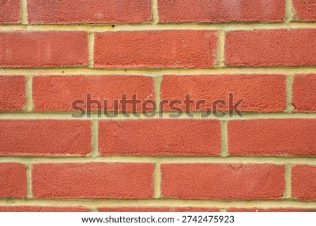 A recently built red brick wall background texture