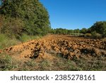 Recently plowed ocher soil in Vaucluse, France. Agriculture in the fall.