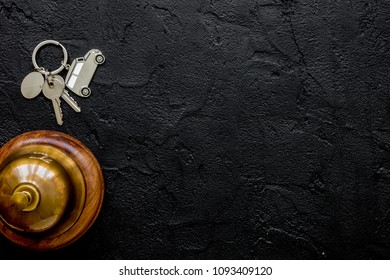 reception desk in hotel with ring and keys dark background top v