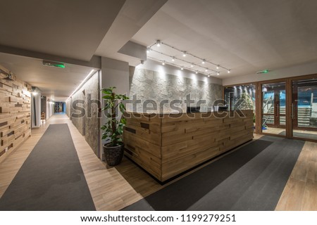 Reception desk and view on hallway in modern hotel