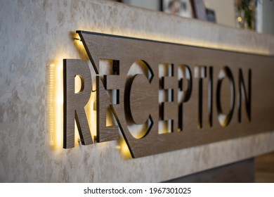 The Reception Sign On The Desk In The Hotel