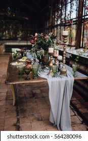 Reception Table Decorated By Grey Vintage Cloth, Candles, Bouquets Of Hydrangea And Greenery, With Windows On Background. Loft. Wedding. Decor