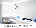 Reception and waiting room of hospital or office. Light clean interior of clinic. Sofa in entrance area, hall with minimalist design. Inside modern hallway with nice decor.