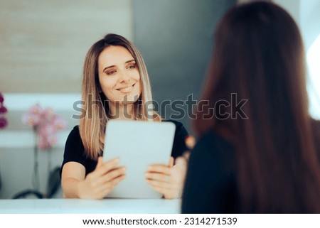 
Receptionist Holding Tablet PC Welcoming a New Client. Front desk officer clerk greeting guests in a hotel reception
