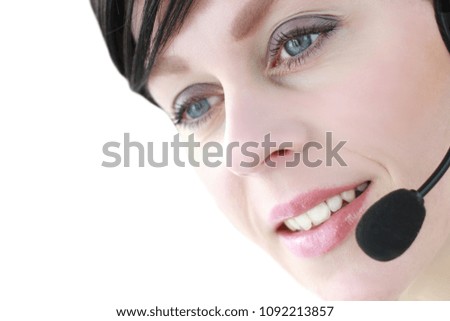 receptionist in an office with headphone calling a customer on line stock photo