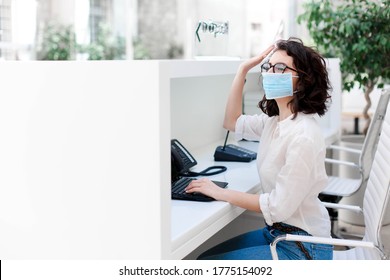 Receptionist Wearing Protective Mask At Reception In Hotel. Protection Employees On Workplace. Young Woman Working In Office And Greeting Colleagues. Social Distancing During Quarantine, Staff Safety.