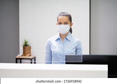 Receptionist Woman At Office Reception Wearing Face Mask