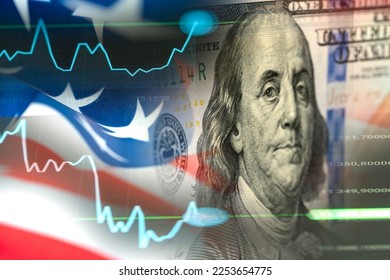 Recession and inflation in US economy. Financial crisis, bankruptcy of banks. Red arrow going downwards above US business graph in front of 100 dollar bill and flames. Economists forecast for the US