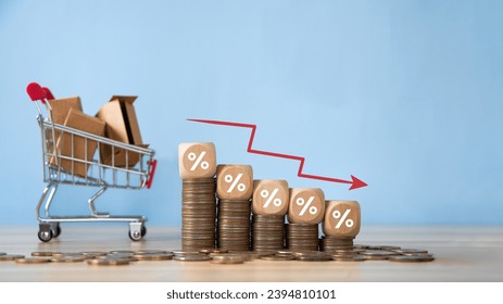 The recession. Percentage sign on wooden cubes with Stack of coin bar chart and red graph trending downwards. Economy recession crisis, inflation, stagflation, business and financial loss concept.  - Shutterstock ID 2394810101