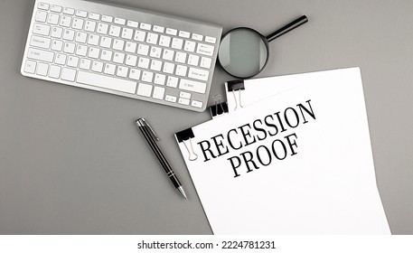 RECESSION PROOF text on a paper with keyboard, magnifier and pen. Business concept - Shutterstock ID 2224781231