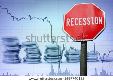 Recession sign on economy background - graph and coins. Financial crash in world economy because of coronavirus. Global economic crisis, recession. Corona virus pandemic, COVID-19 outbreak.