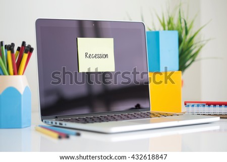Recession sticky note pasted on the laptop