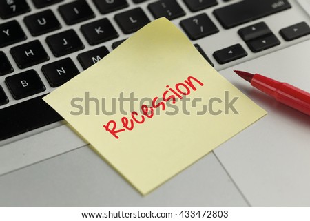 Recession sticky note pasted on the keyboard