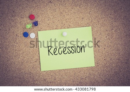 Recession written on sticky note pinned on pinboard