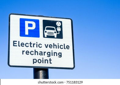 Recharging Point For Electric Vehicles Sign Against Clear Sky