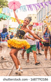 Recife, Pernambuco / Brazil - March 1st, 2019: A frevo dancer poses in downtown Recife during carnival.