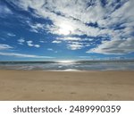 Recife - State of Pernambuco, Brazil - December 23, 2023: Photograph of Boa Viagem beach in Recife, with a beautiful blue sky, some white clouds, golden sand and a silvery sea.