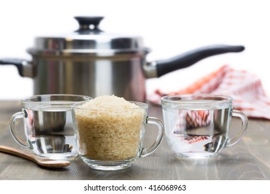 The Recipe For Steamed Rice. One Cup Of Rice And Two Cups Of Water