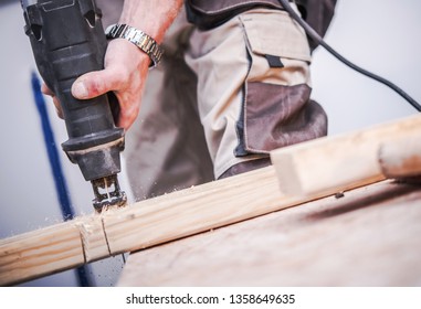 Reciprocating Saw Wood Cut. Construction Worker Using Power Tools at Work. - Shutterstock ID 1358649635