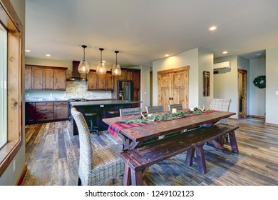 Reclaimed Wood Trestle Dining Table Decorated For Christmas In A Luxury American Country House.