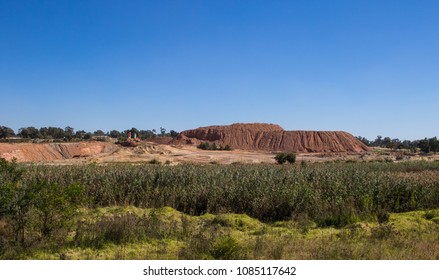 Reclamation has removed most of the historic gold mining dumps around the city of Johannesburg in South Africa image with copy space in landscape format - Shutterstock ID 1085117642