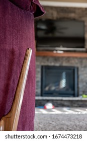 Reclining Chair Handle With Blurred TV And Fireplace In Background