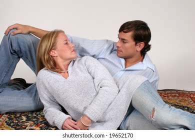 Reclining Couple Looking At Each Other With Pleasure