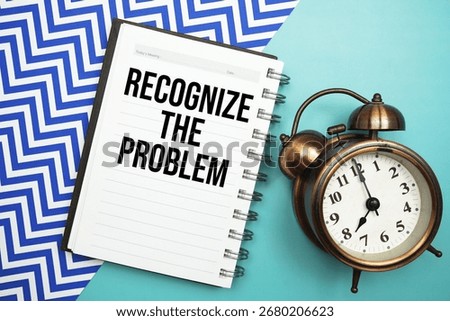 Recognize The Problem text written on notepad with alarm clock