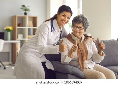 Recommended Professional Medical Service For Elderly People, Age Medicine Concept. Happy Smiling Hispanic Female Doctor And Old Lady Patient Gesturing Thumbs Up To Camera Showing Satisfaction Emotion