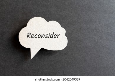 Reconsider Word Written On Cardboard Speech Bubble