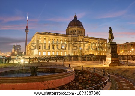 The reconstructed City Palace and the famous Television Tower in Berlin before sunrise