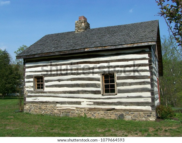 Reconstructed Primitive Log Cabin Featuring Stone Stock Photo