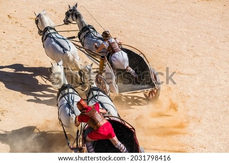 Reconstruction, in arenas, of a Roman chariot race.