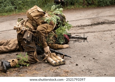 Reconstruction of battle from the Second World War. British paratrooper soldiers during combat.