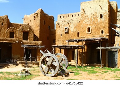 Reconstruction of the clay buildings and old wheeled cart in the ancient Tatar-Mongols capital of Sarai Batu