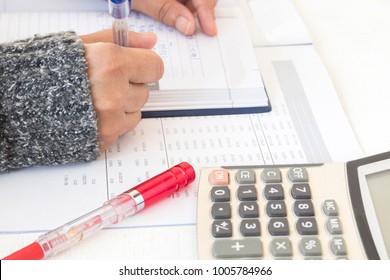 Record Expense Income And Financial Statement Yearly Balance Sheet With Hand Of Woman Working At Office Desk